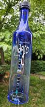 Load image into Gallery viewer, Upcycled Milagro Tequila Bottle Wind Chime
